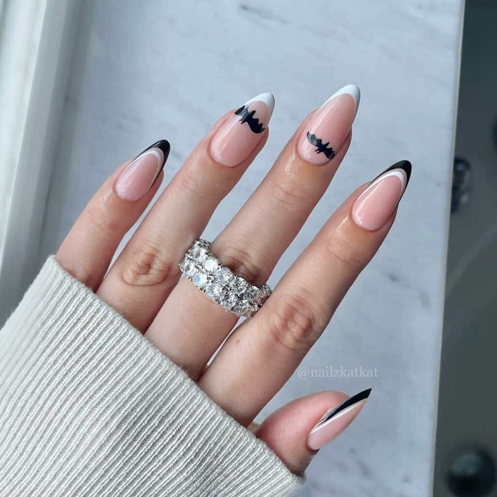 30 Latest Black Almond Nail Ideas To Try In 2024! 31 White and Black Almond Nails with Bats