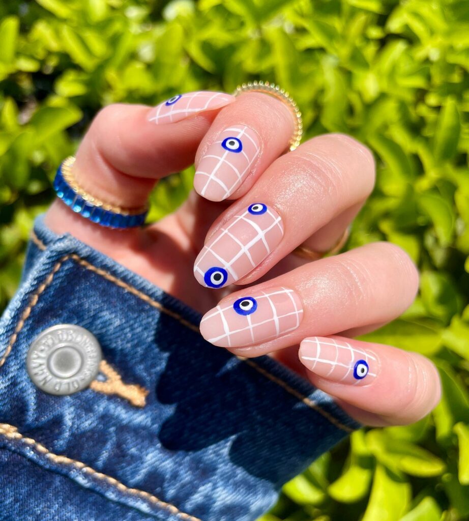 Channel Mystique with 20 Evil-Eye Nail Designs for 2024 19 White-and-Gold evil eye nails