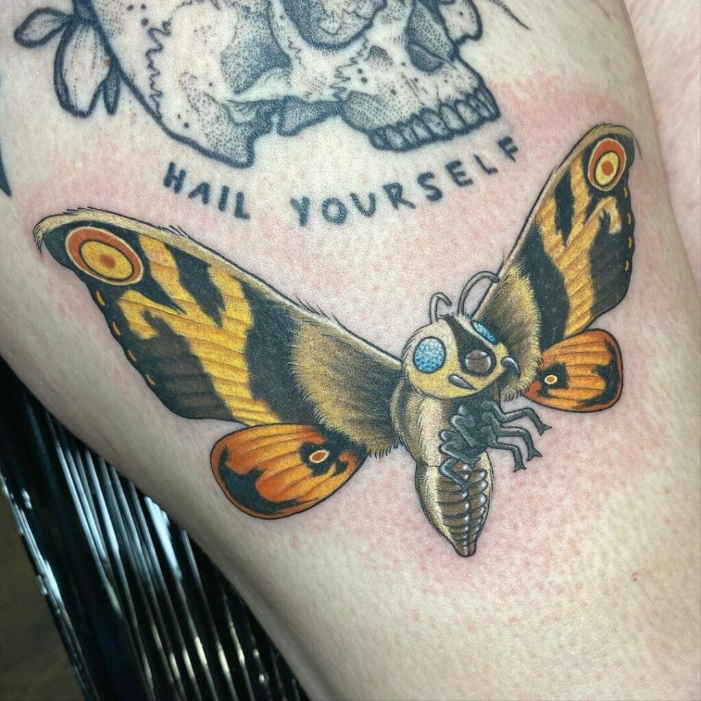 11+ Mothra Tattoo Ideas You Have To See To Believe! 12 Yellow And Black Mothra Tattoo