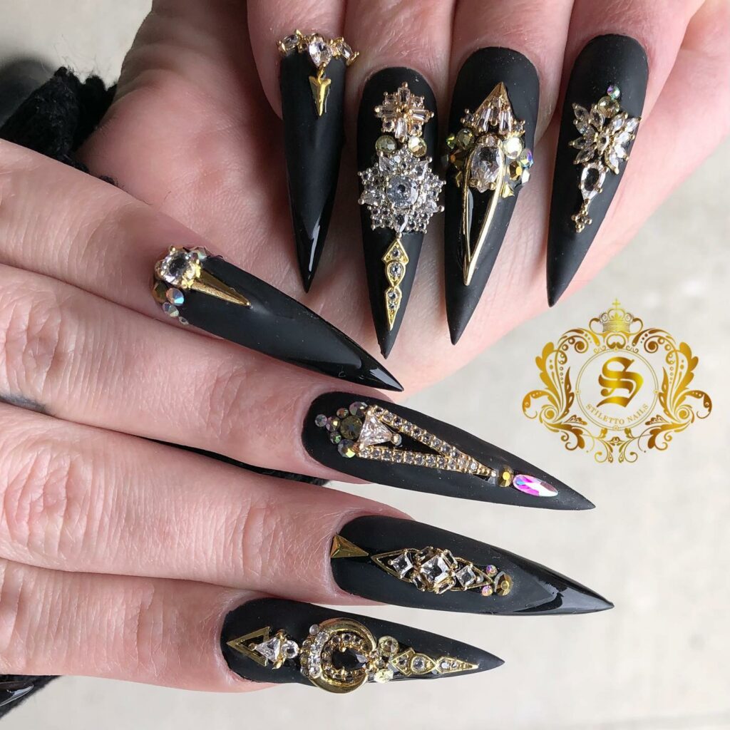 40 Latest Black Stiletto Nail Ideas To Try In 2024! 36 black and Gold Stiletto Nails