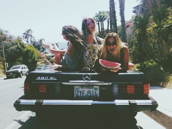 What to Wear to a Beach Party 46 Girls sitting on the back of a car having fun