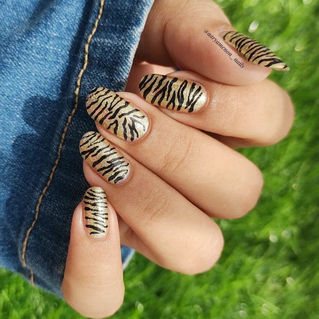 40 Latest New Year’s Nail Art Ideas To Try In 2024 32 glittery zebra print Nails