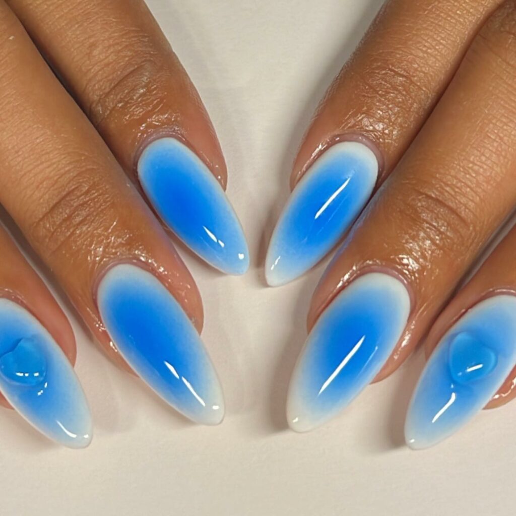 Experiment with 30 Stunning Blue Ombré Nails for 2024 30 iridescent blue ombre nails