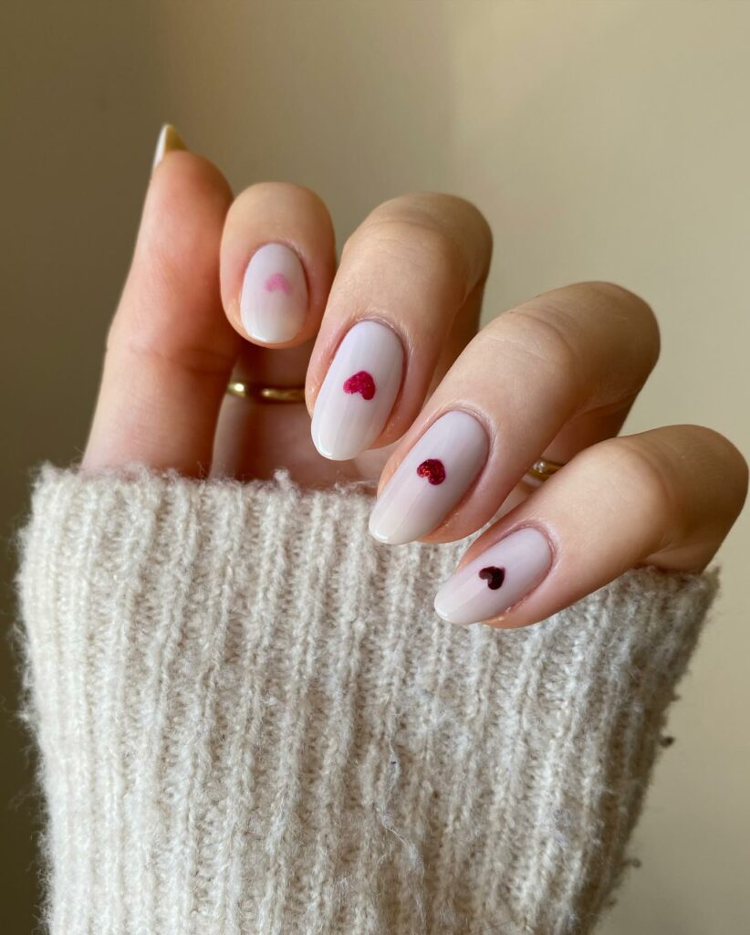 Latest Red to Pink Color Palette Nail Design To Try In 2024! 13 Heartfelt Elegance: Minimalist Nails with Precise Hand-Painted Hearts