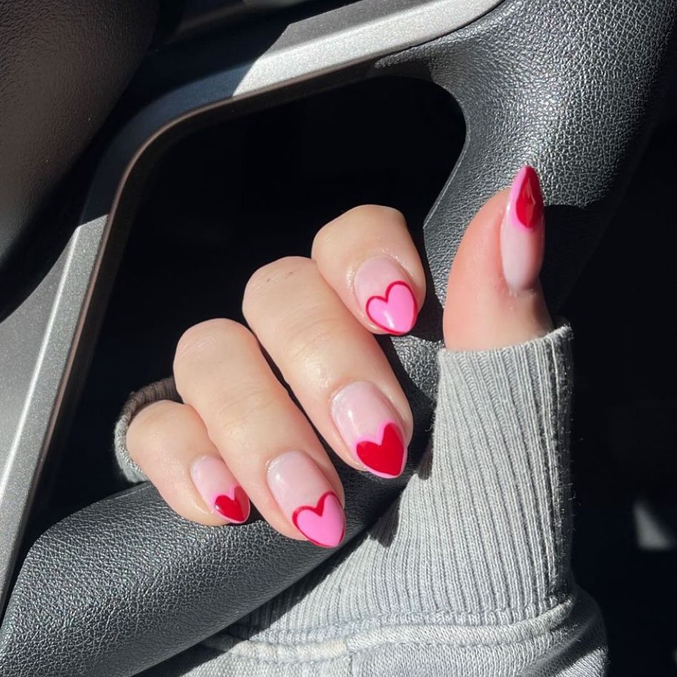 14 Cute Valentine’s Day Nail Ideas To Try in 2024! đŸ’… 12 Romantic Flare: Valentine's Day Nail Art with Red Heart Tips