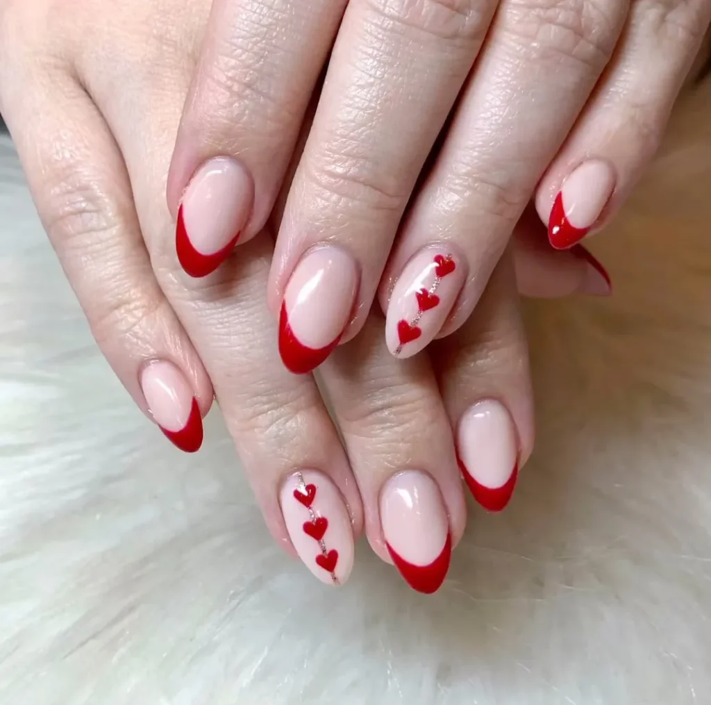 16 Cute Valentine’s Day Nail Designs To Try in 2024! 💅💅 21 Romantic Red French Tips with Hearts for Valentine's Day