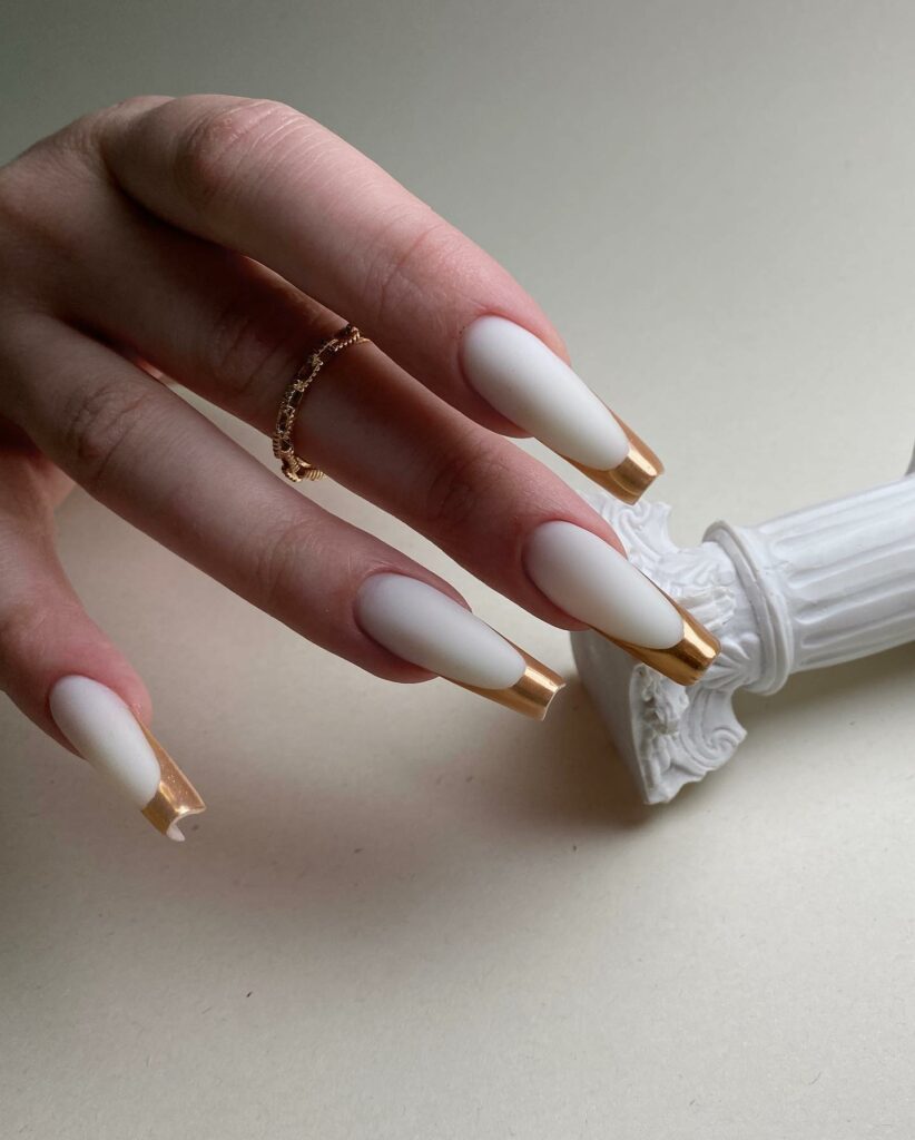 55 Latest Gold French Tip Nail Ideas To Try In 2024! 18 Matte White With Gold French Nails