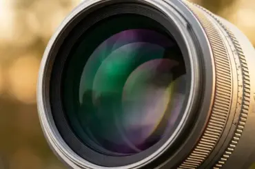 A camera lens featuring high-index glass and VCM autofocus technology, showcased as a top deal for the Amazon Prime Day event.